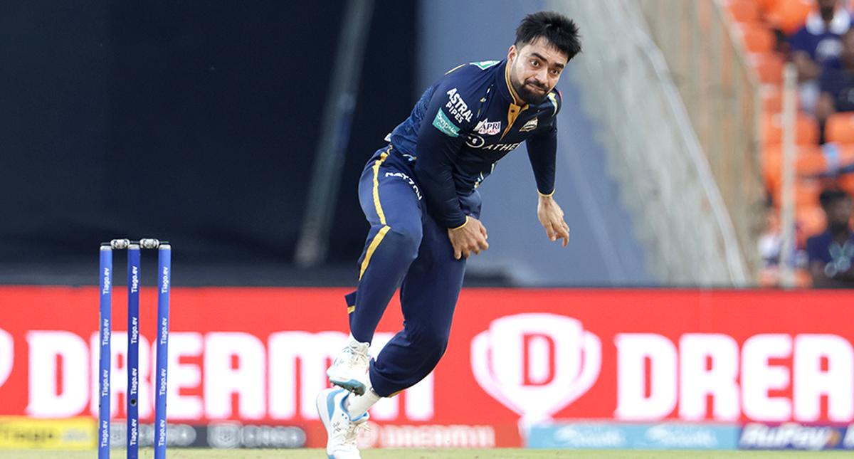 FILE PHOTO: Rashid Khan captain of Gujarat Titans bowls during the Tata Indian Premier League match between the Gujarat Titans and the Kolkata Knight Riders. 