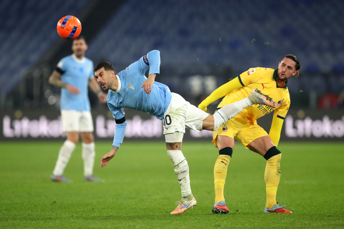 Rome, Italy - December 04: Mattia Zaccagni of Lazio is challenged by Adrien Rabiot of ac Milan during the coppa Italia round of 16 Match Between SSO and AC Milan at Olimpico Stadium on December 04, 2025 in Roman, Italy. (Photo by Paolo Bruno/Getty Images)