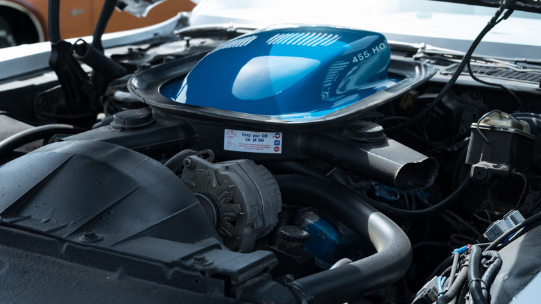 A close-up of the Pontiac Trans Am 455 HO engine showing the shaker in blue