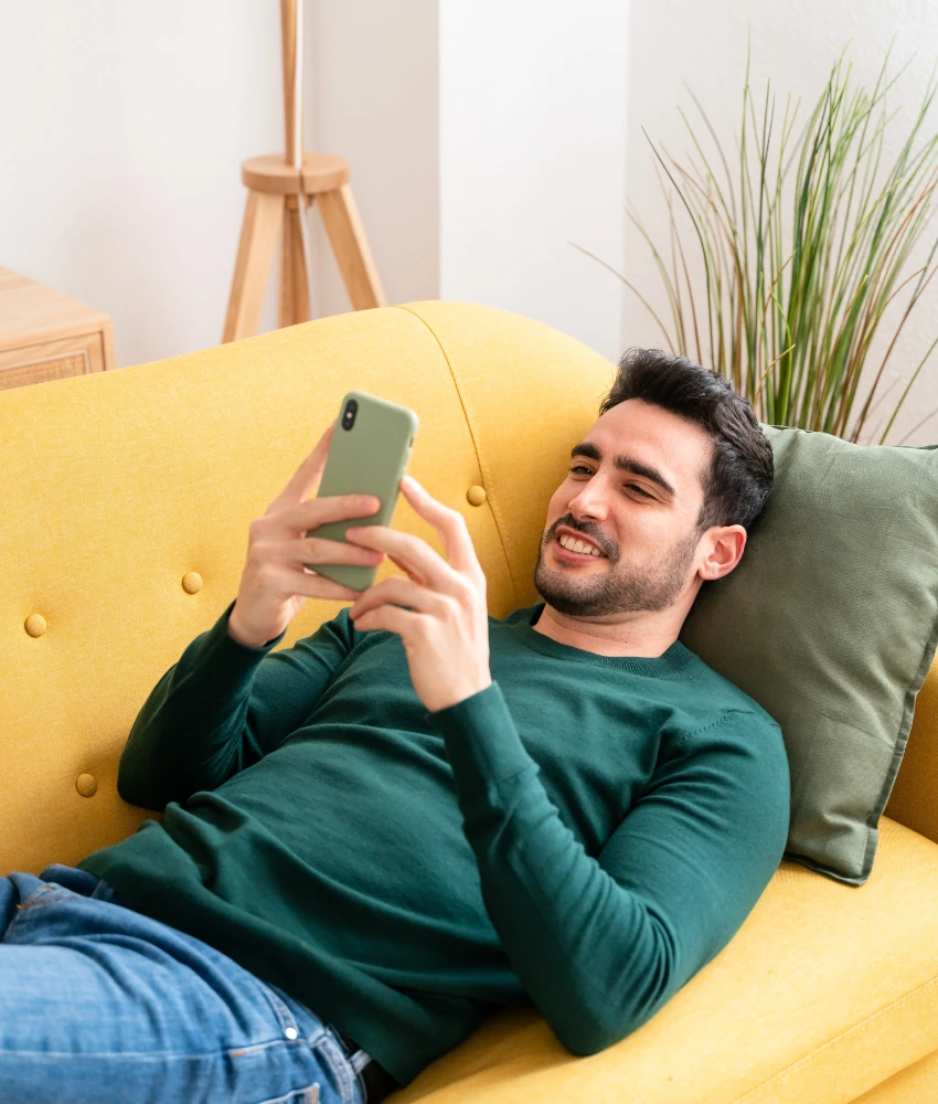 man relaxing even though girlfriend works just as hard and still does chores
