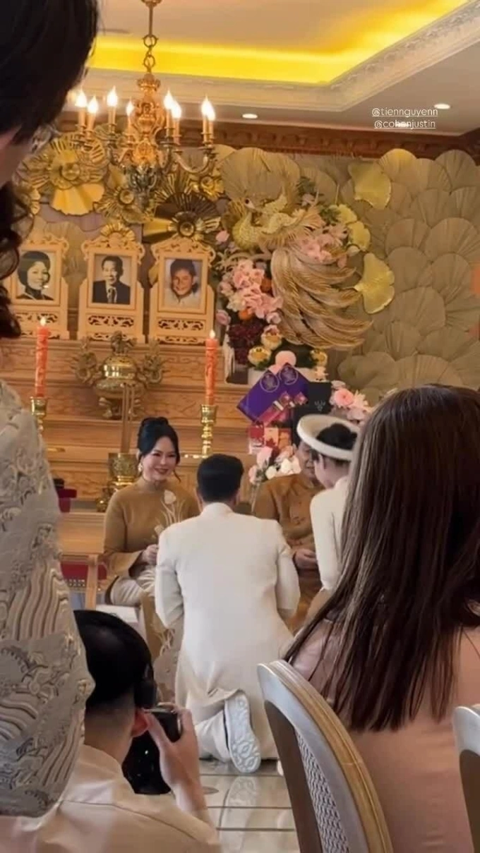 Tien Nguyen and her husband knelt to greet their parents