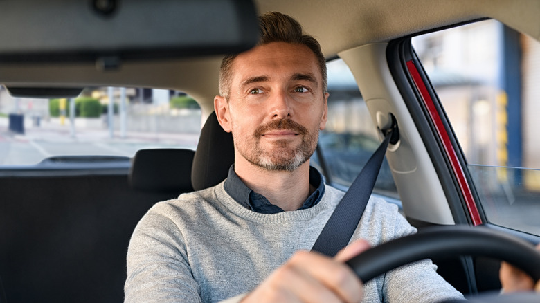 Driver looking at rear view mirror