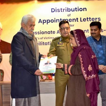 J&K Lieutenant Governor Manoj Sinha handing over appointment letter to a family member of terror victim LG Manoj Sinha