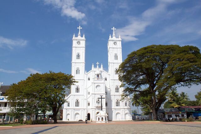 This may contain: a large white church with two tall towers