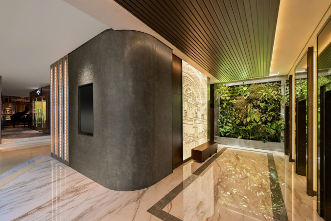 The lift lobby at at Sheraton Saigon Grand Opera Hotels Grand Opera Tower is filled with ambient lighting and vertical gardens. Photo courtesy of Grand Opera Tower