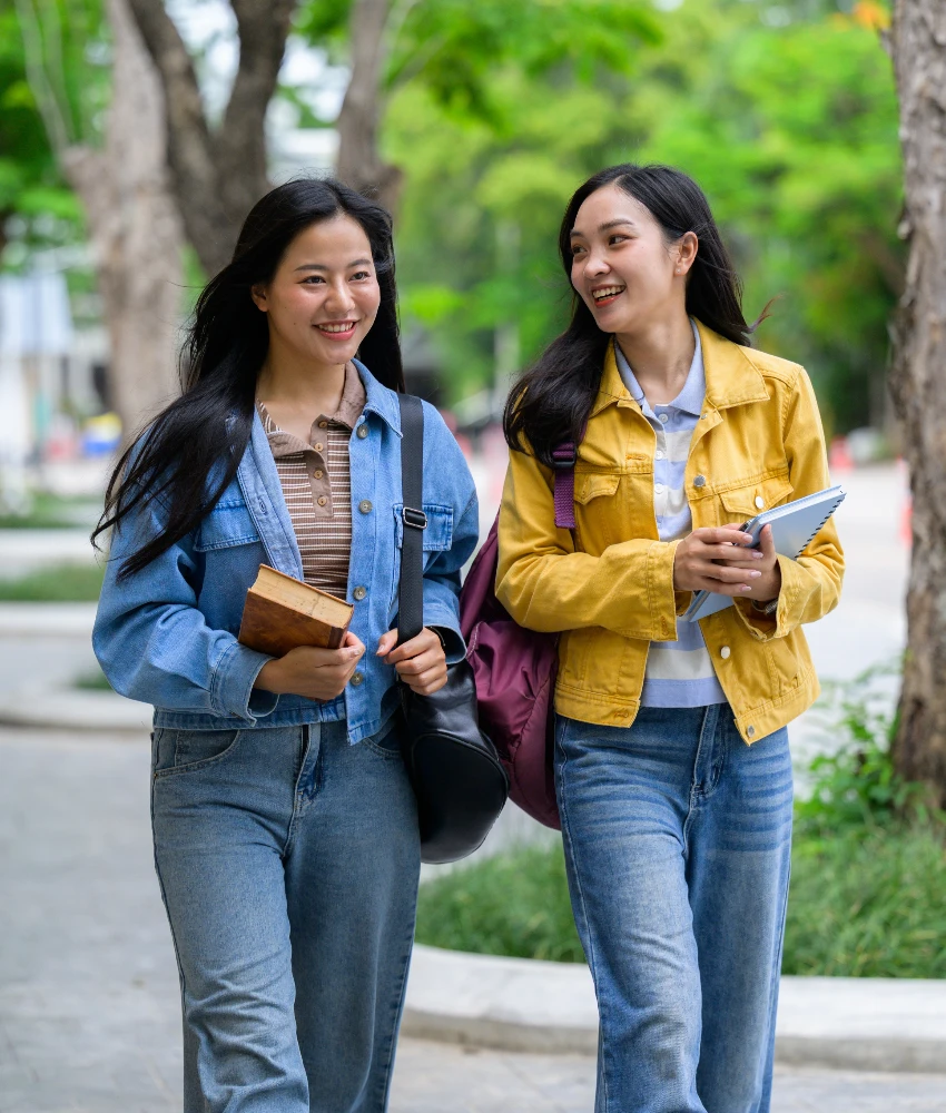 young adult women talking at college