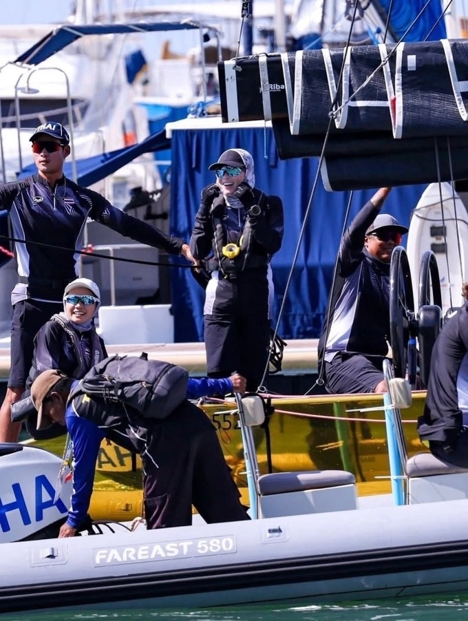 Queen of Thailand Suthida Bajrasudhabimalalakshana (C) before a race in the SSL47 keelboat event at the 33rd SEA Games. Photo by Instagram/@thairoyalfamily