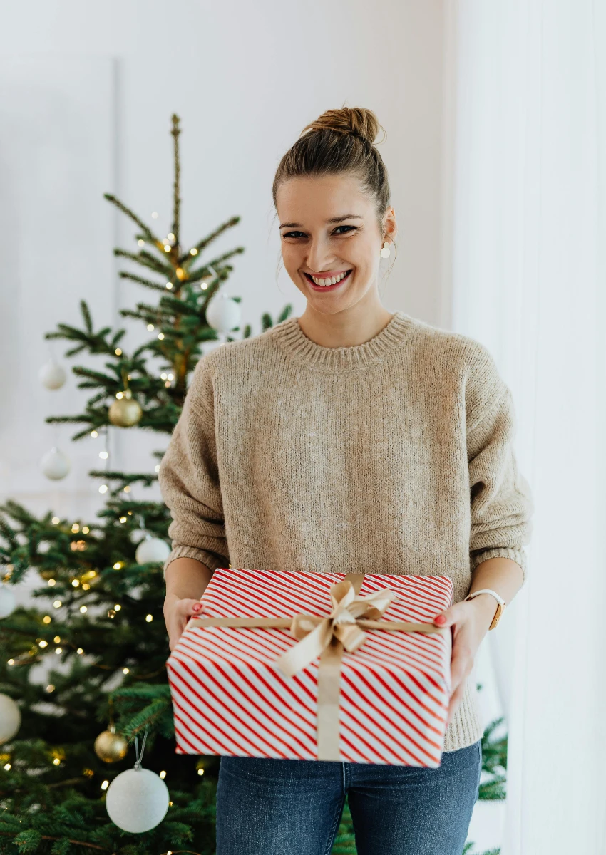 woman giving gift she's excited about
