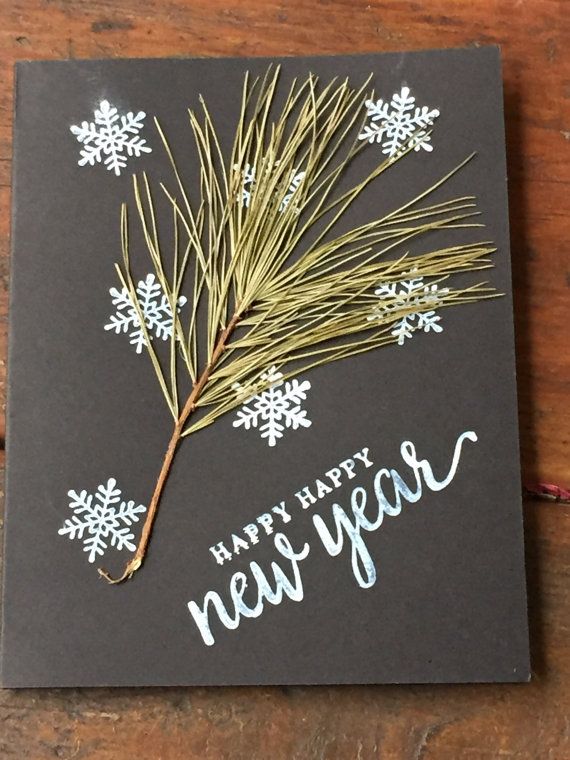 This may contain: a black card with white snowflakes and the words happy new year on it