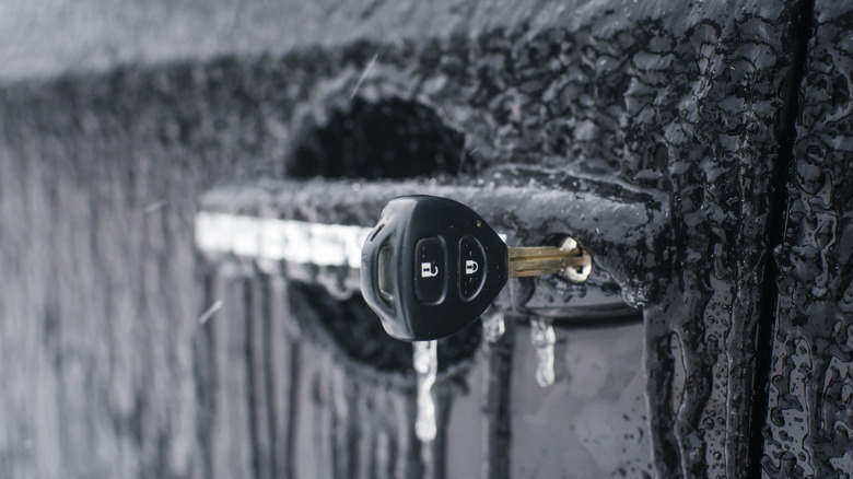 Frozen car door with key in the keyhole