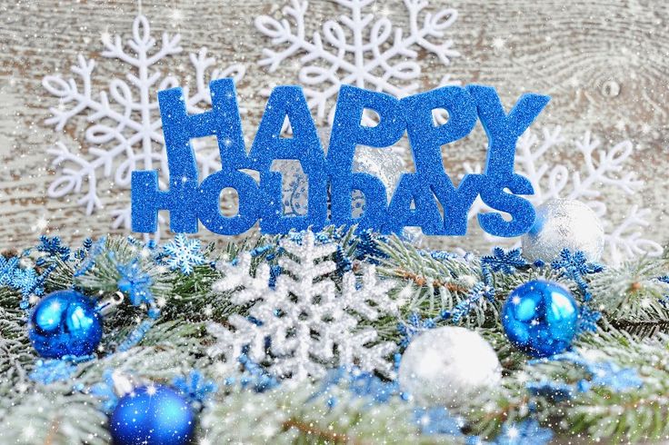 This may contain: a blue happy holidays sign surrounded by snowflakes