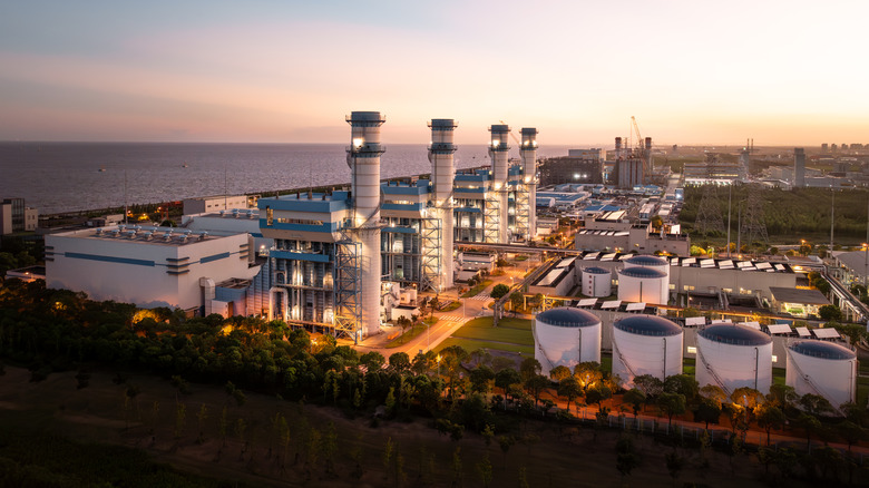 Aerial shot of a seaside power plant in the evening.
