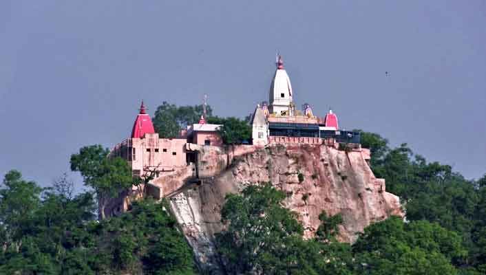 This may contain: a castle on top of a hill surrounded by trees