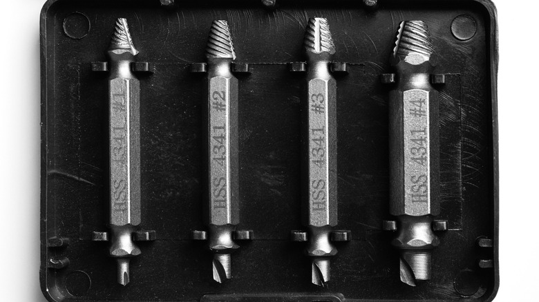 A set of screw extractors in a storage case.