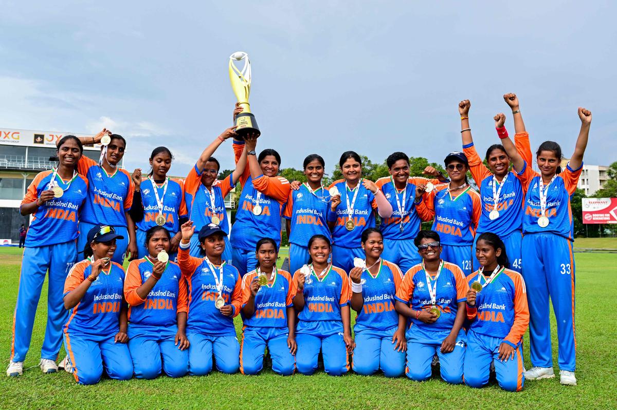 India's players pose with the trophy after winning against Nepal at the Blind Women's Twenty20 World Cup 2025 final match in the P. Saravanamuttu Stadium in Colombo.