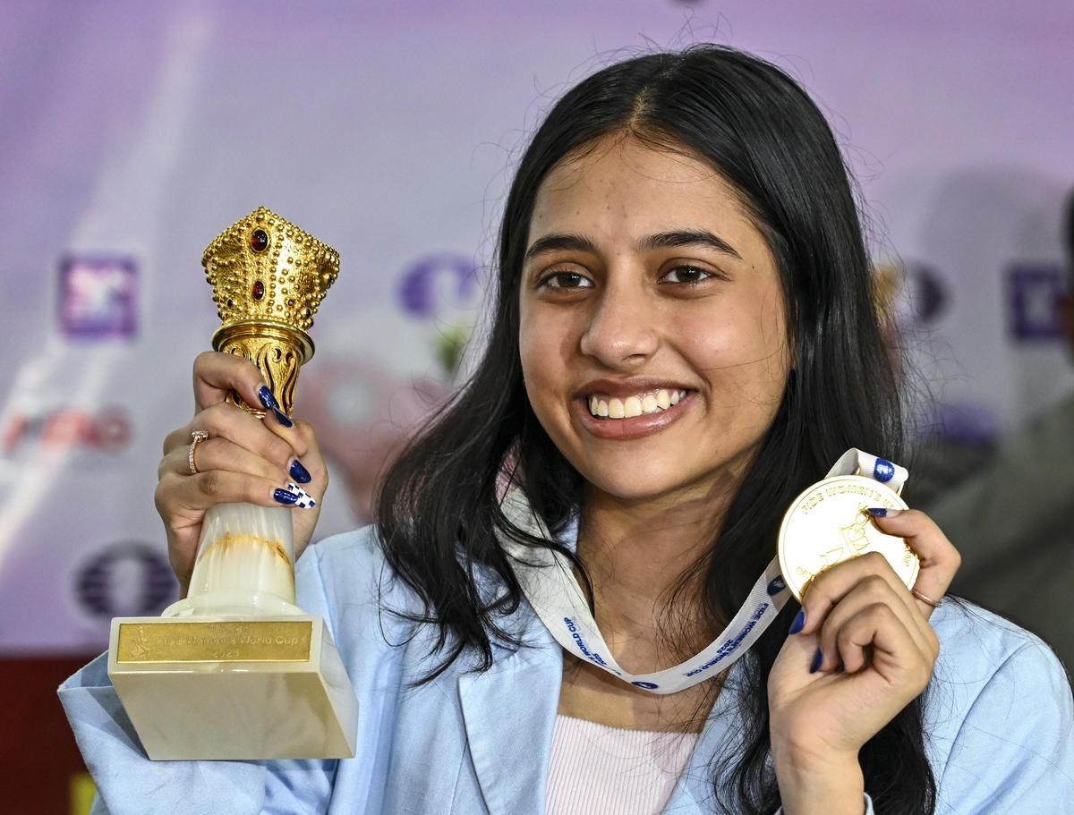FIDE Women’s World Cup champion Divya Deshmukh poses with her trophy and medal.