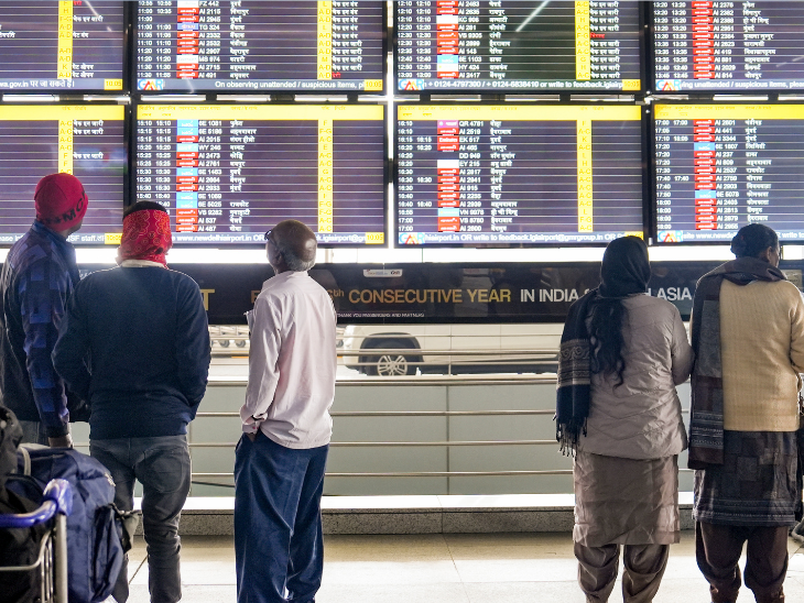 At Delhi Airport, passengers were seen watching check-in information on a big screen at Terminal 3.