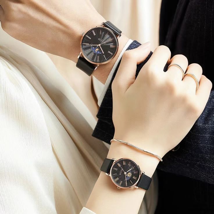 This may contain: two women wearing matching watches on their wrist