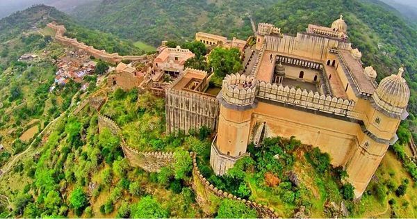 This may contain: an aerial view of a castle in the mountains