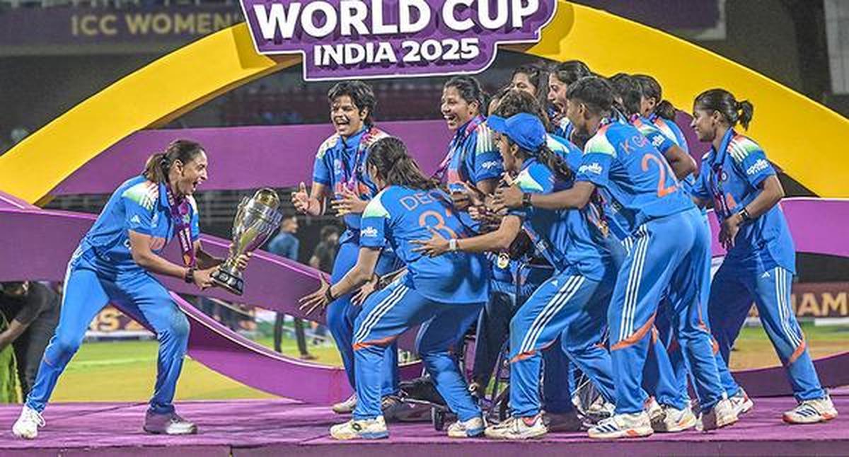 Indian women’s team captain carries the ODI World Cup trophy towards her teammates after beating South Africa in the final. 