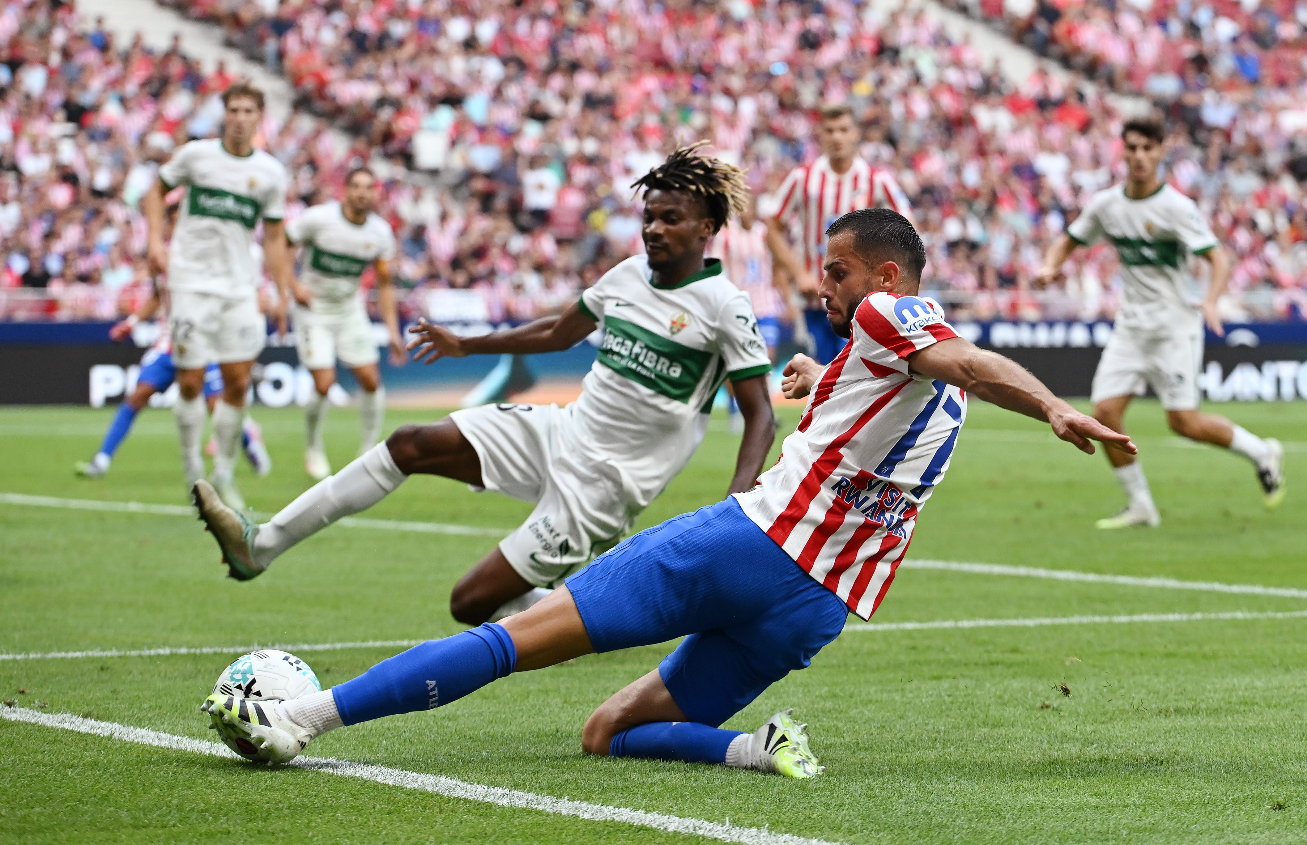 Hancko crosses the ball in.