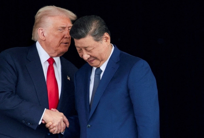 U.S. President Donald Trump and Chinese President Xi Jinping talk as they leave after a bilateral meeting at Gimhae International Airport, on the sidelines of the Asia-Pacific Economic Cooperation (APEC) summit, in Busan, South Korea, October 30, 2025. Photo by Reuters