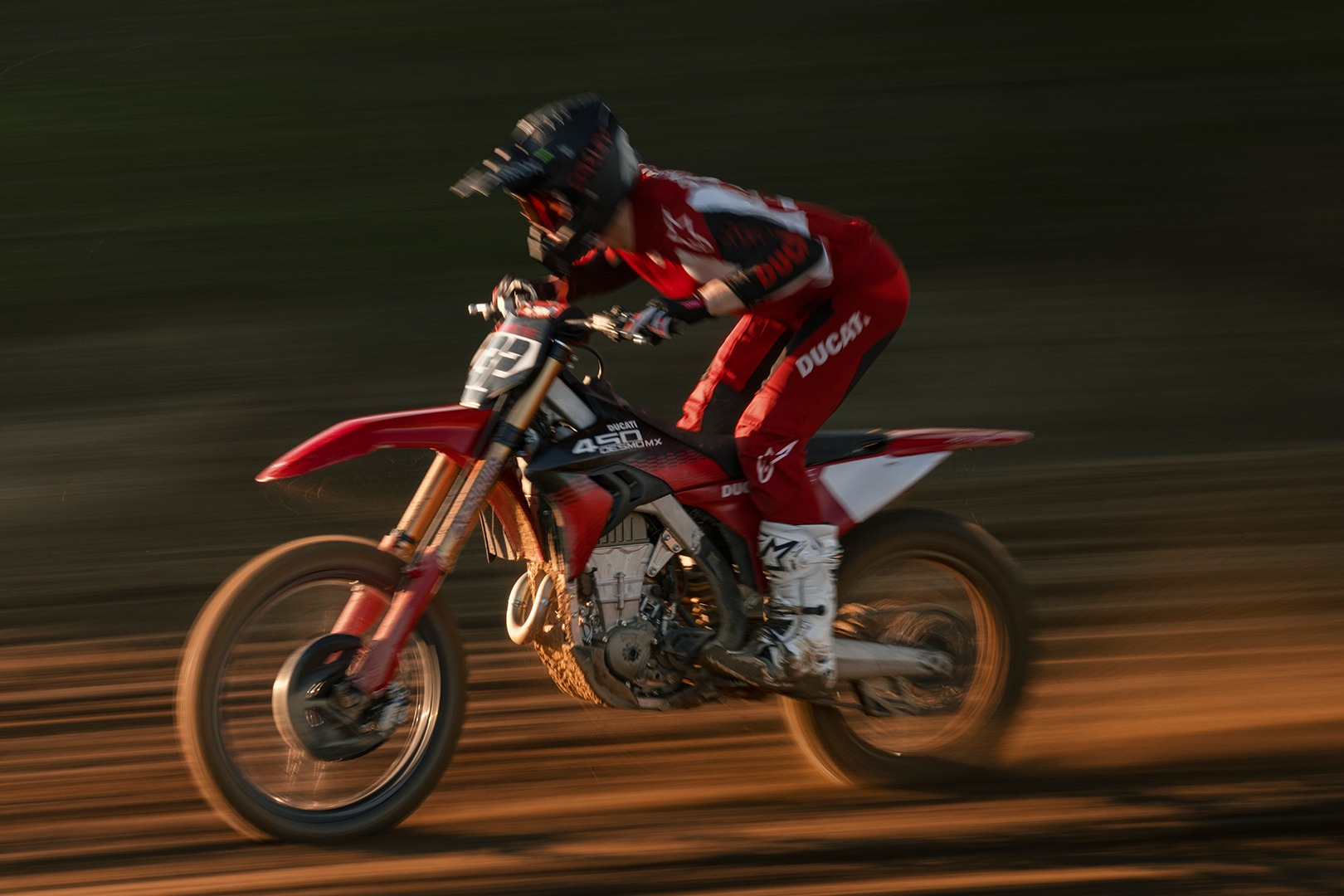 May be an image of dirt bike, motorcycle and text