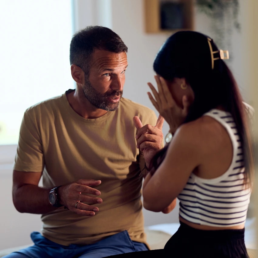 Stressed husband and wife having a conversation about feelings 