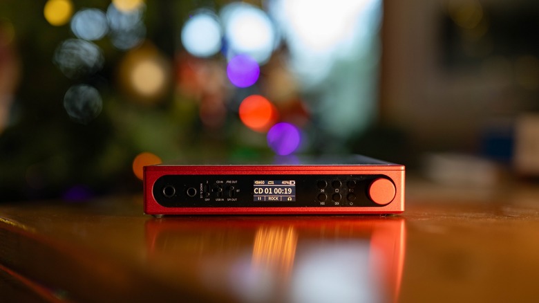 The front panel of the DM15 R2R with Christmas tree lights in the background.