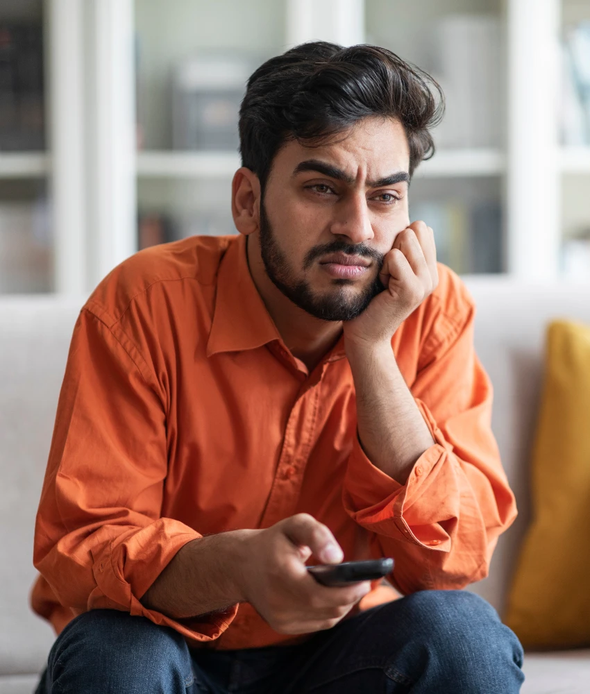 millennial man frustrated by streaming services