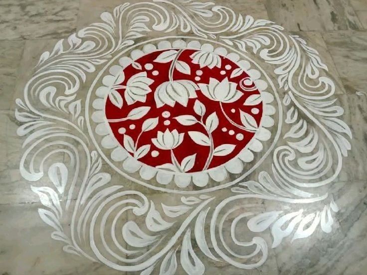 This may contain: a white and red design on a marble floor