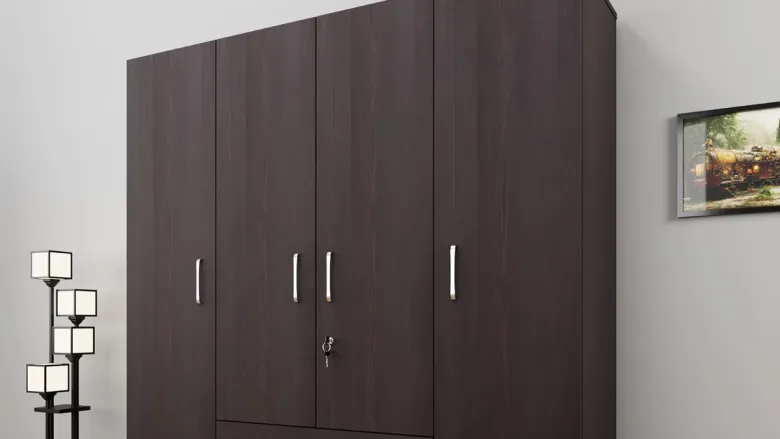 a brown color almirah with lamp and frame on the wall