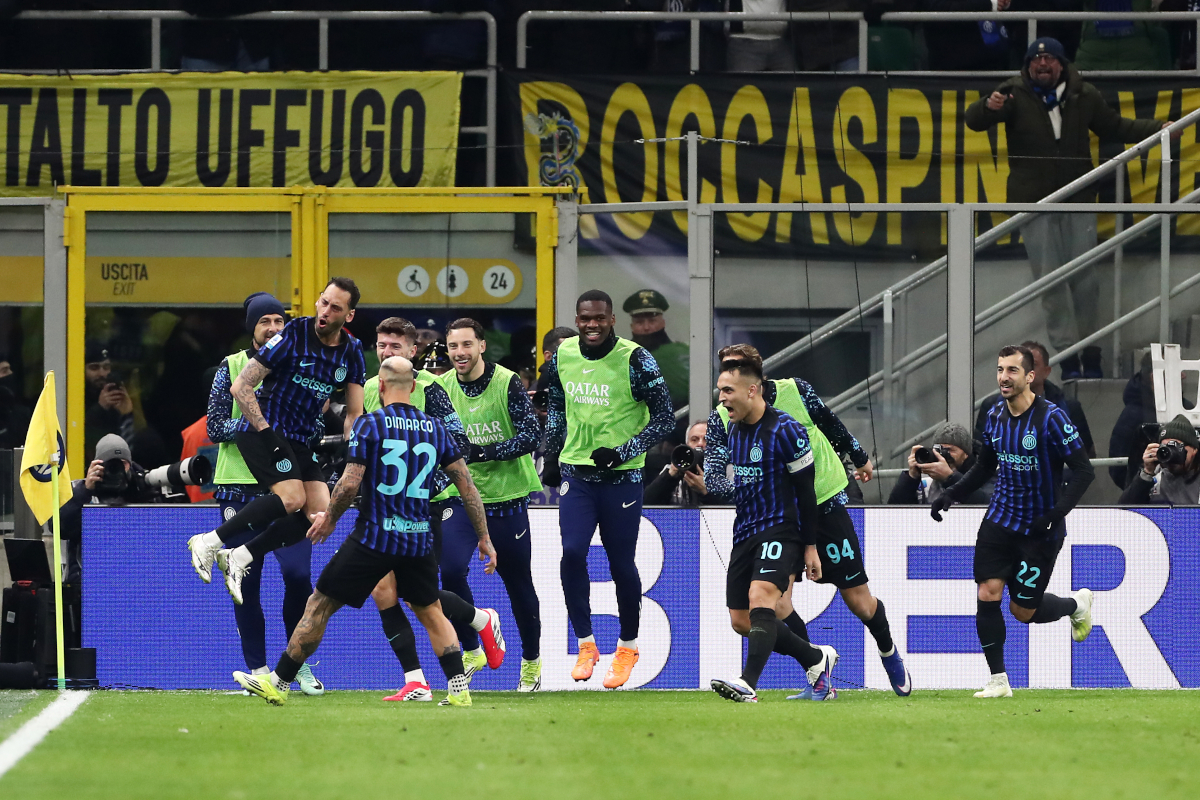 MILAN, ITALY - JANUARY 11: Hakan Calhanoglu of FC Internazionale Milano celebrates scoring his team's second goal with teammates during the Serie A match between FC Internazionale and SSC Napoli at Giuseppe Meazza Stadium on January 11, 2026 in Milan, Italy. (Photo by Marco Luzzani/Getty Images)