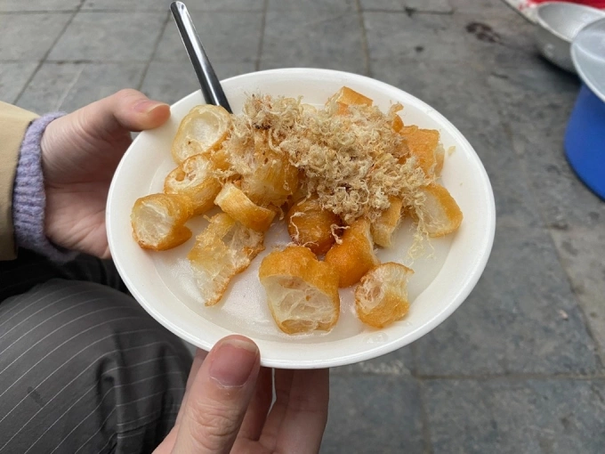 Fried dough, cut into bite-sized pieces, is used as a topping for porridge in Hanoi. Photo by Read/Khanh Ly