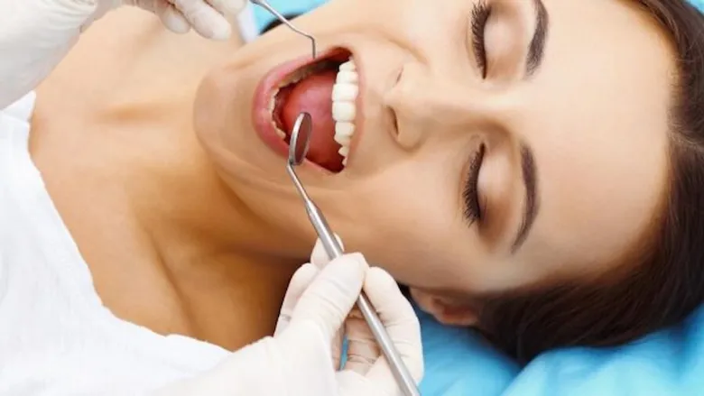 woman getting her tooth treatment
