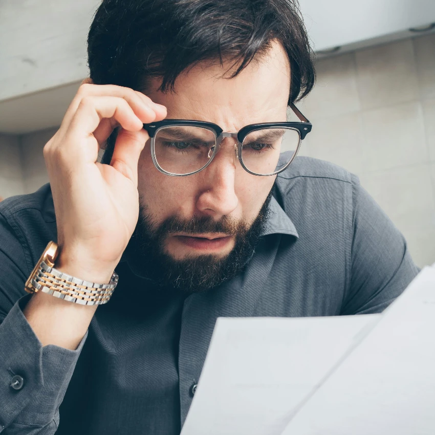 man paying hidden fees