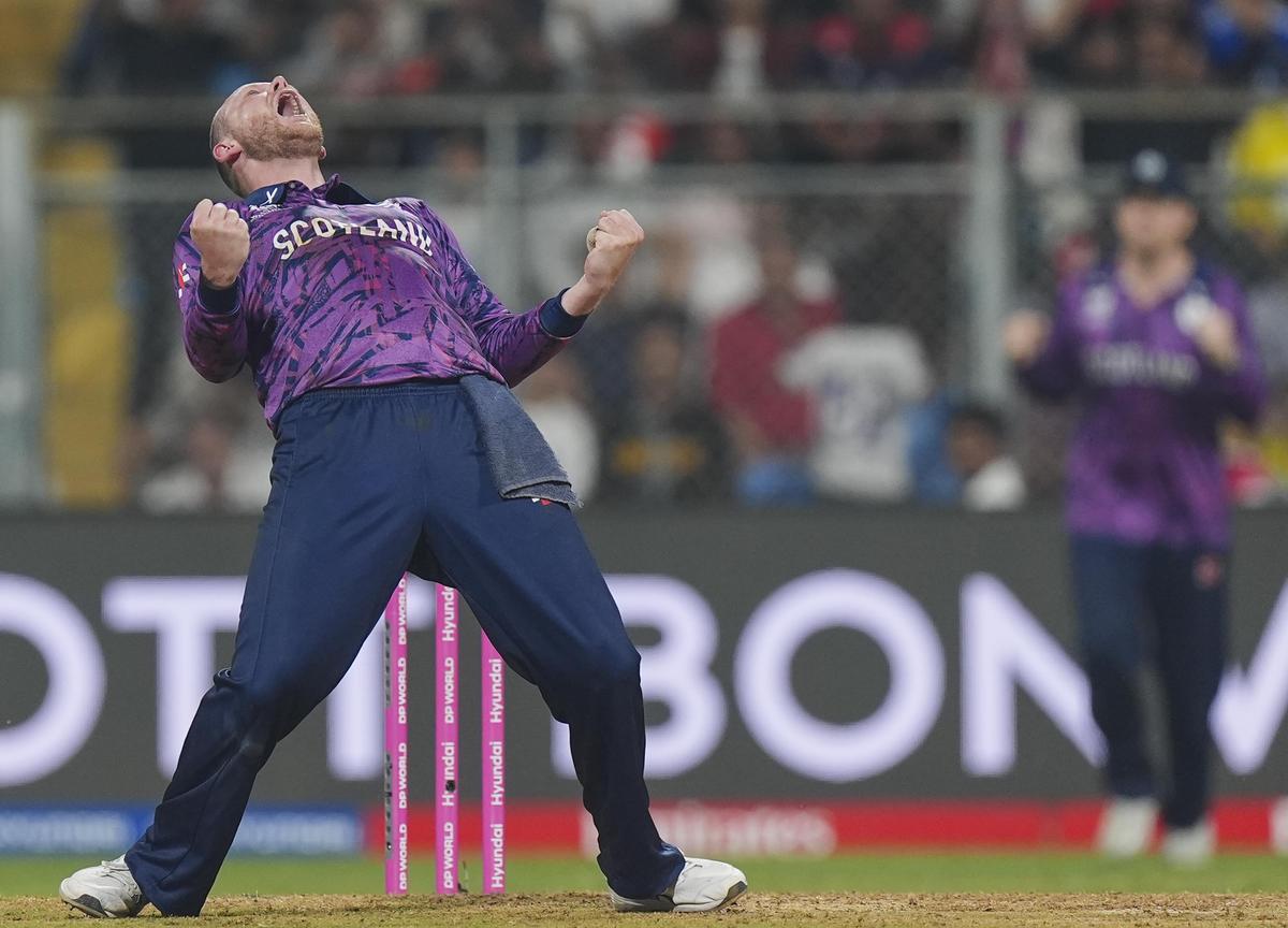 Scotland's Michael Leask celebrates after taking the wicket of Nepal captain Rohit Paudel.