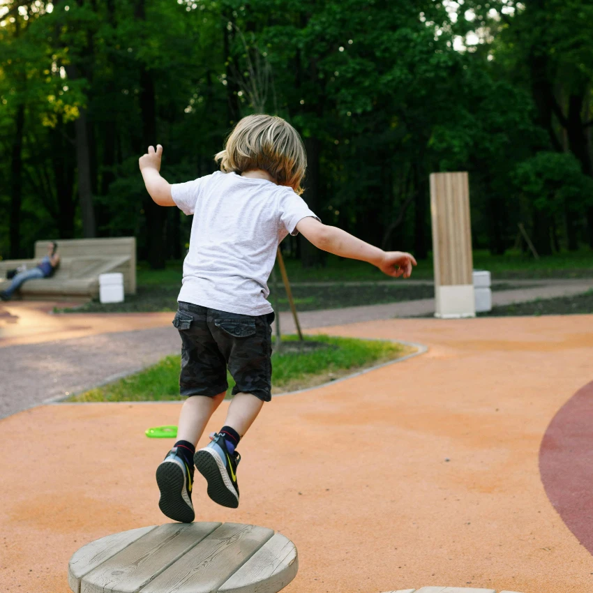 boy playing outside developing his vestibular sense