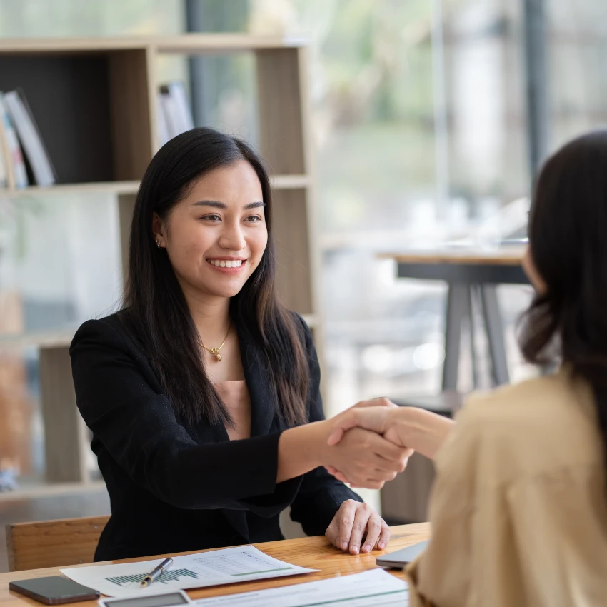 woman shaking hands with interviewer