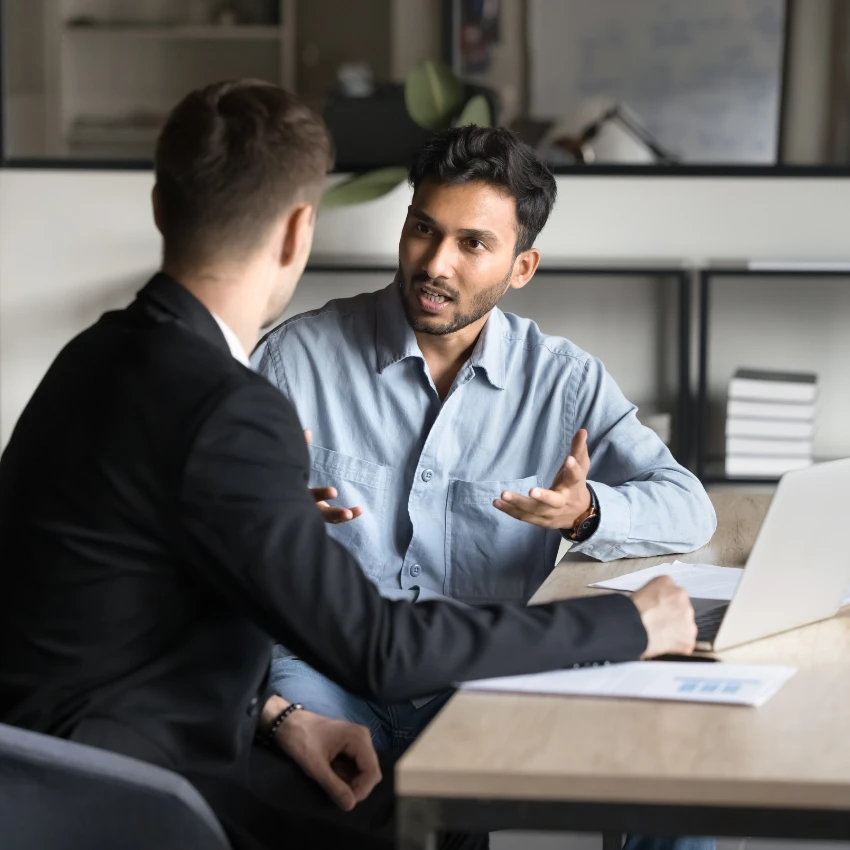 man asking about benefits during job interview