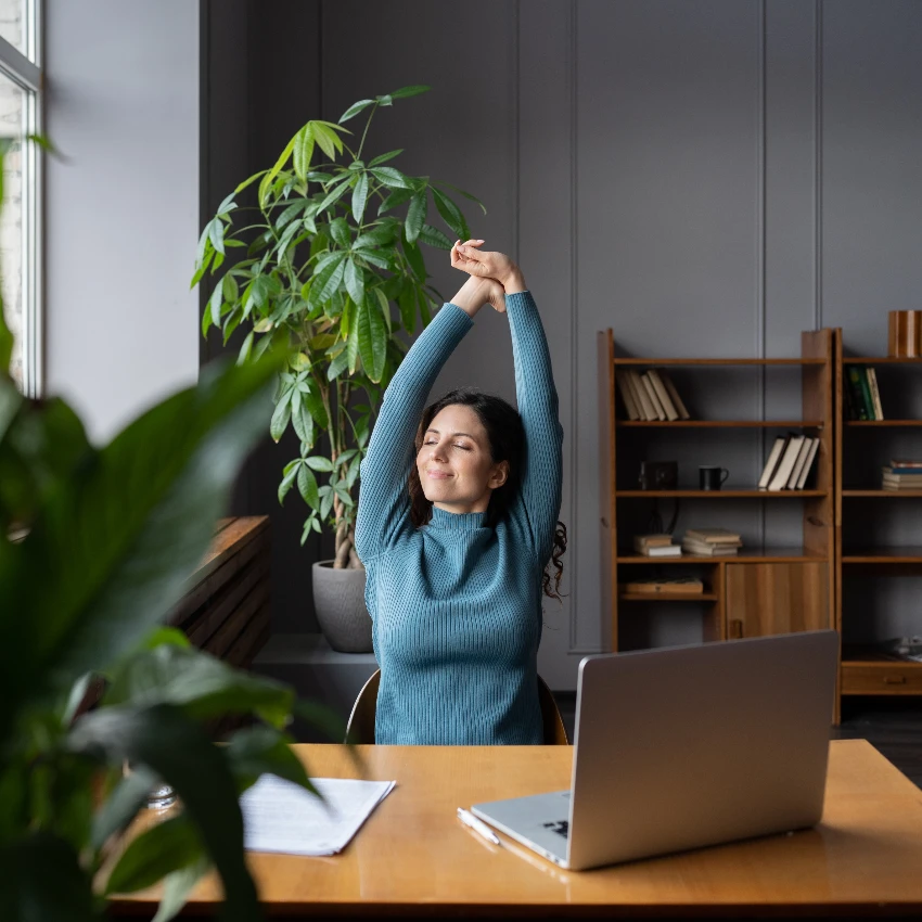 relaxed woman taking intentional break at work 