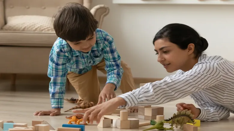a mother playing with her son 