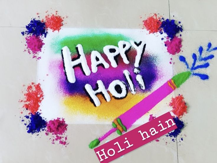 This may contain: the words happy holi written on a piece of paper