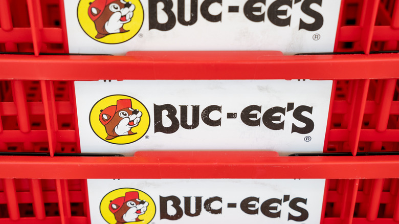 Close-up of Buc-ee the Beaver logo on several stacked shopping baskets
