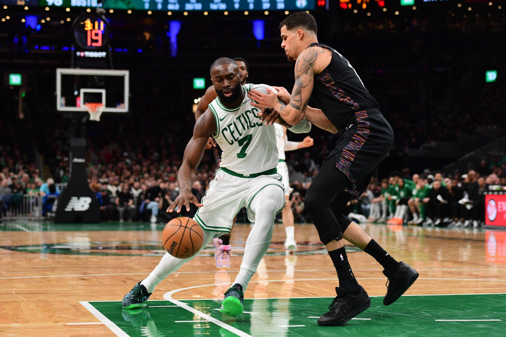 Boston Celtics guard Jaylen Brown (7) dribbling while being defended by Brooklyn Nets forward Michael Porter Jr. (17).