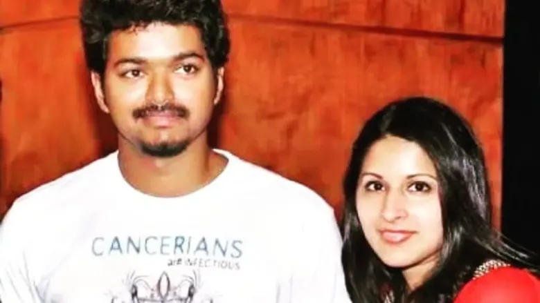 Closeup look of a couple in white t-shirt and orange dress