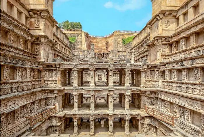This may contain: the inside of an old building with many carvings on it's walls and pillars