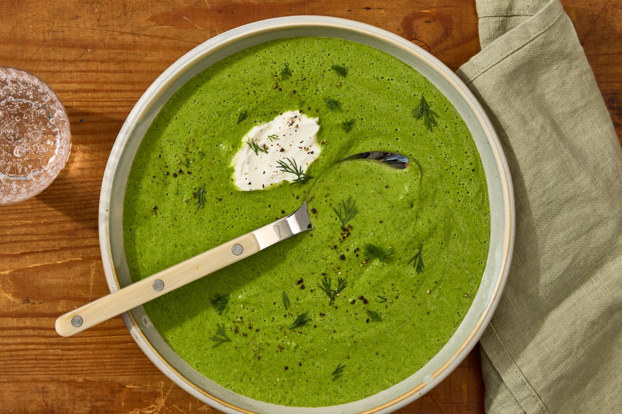 an image of the Baked Feta & Green Spring Vegetable Soup Credit: Photographer: Jen Causey, Food Stylist: Julian Hensarling, Prop Stylist: Lydia Purcell