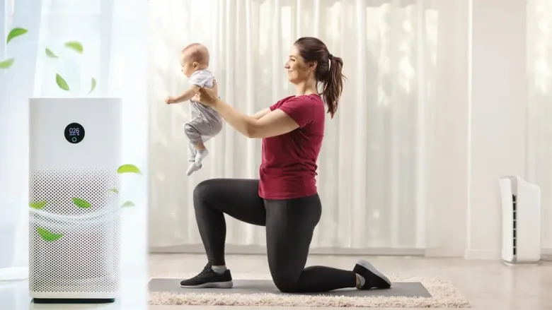 woman holding her child while kneeling down