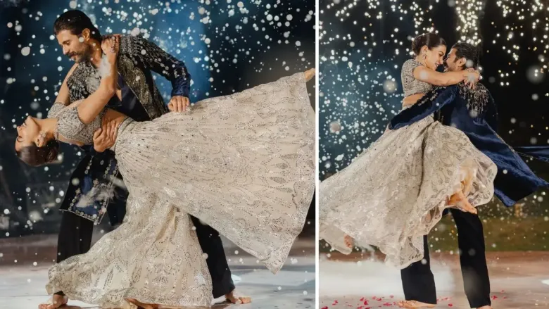 A beautiful couple dancing on the stage against the flashy backdrop 